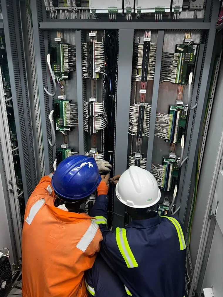 Engineers working on a marshalling cabinet